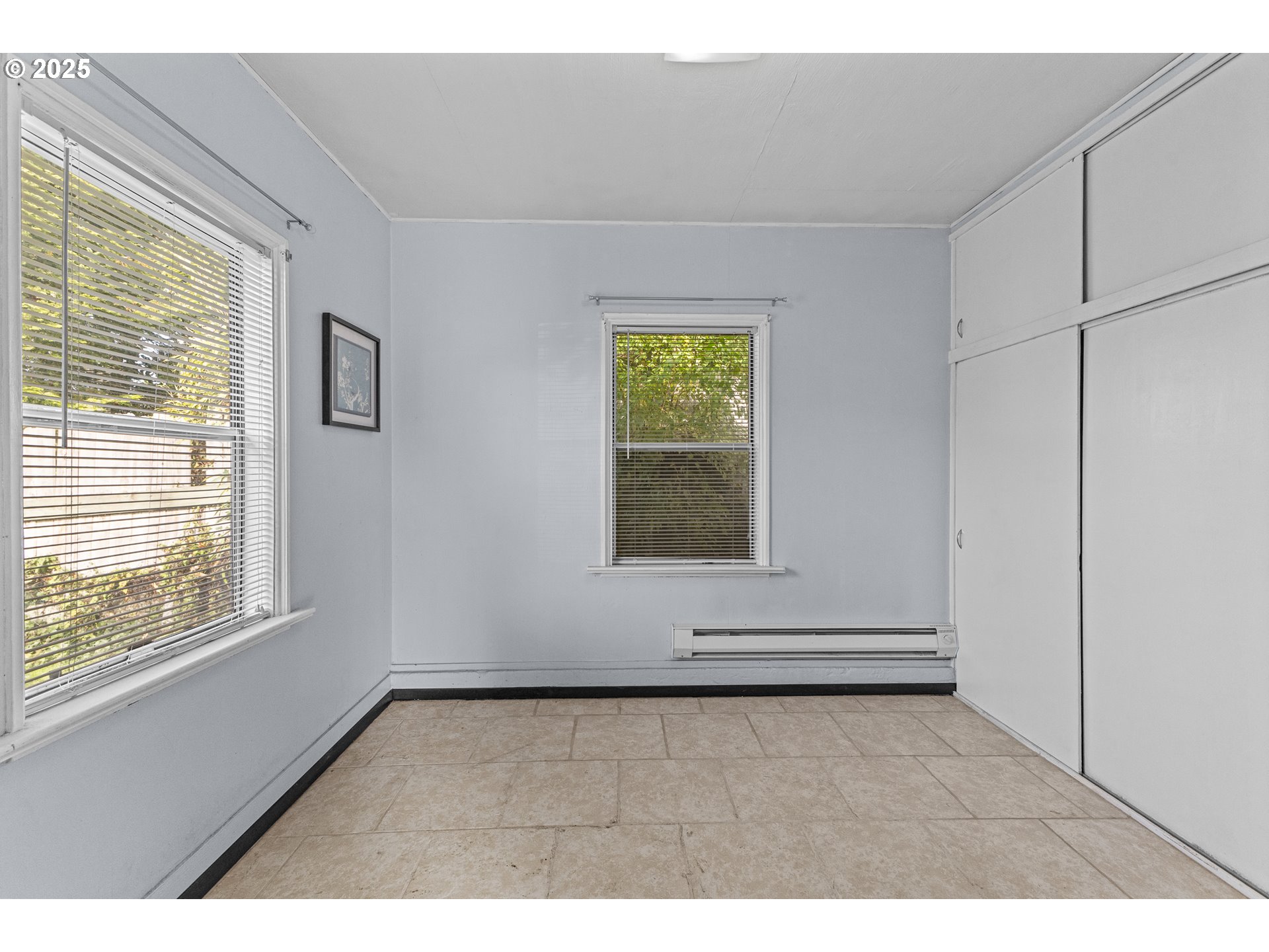 1713 Maple Street Myrtle Point, OR 97458 - Photo 30 of 43 a view of an empty room with wooden floor and a window