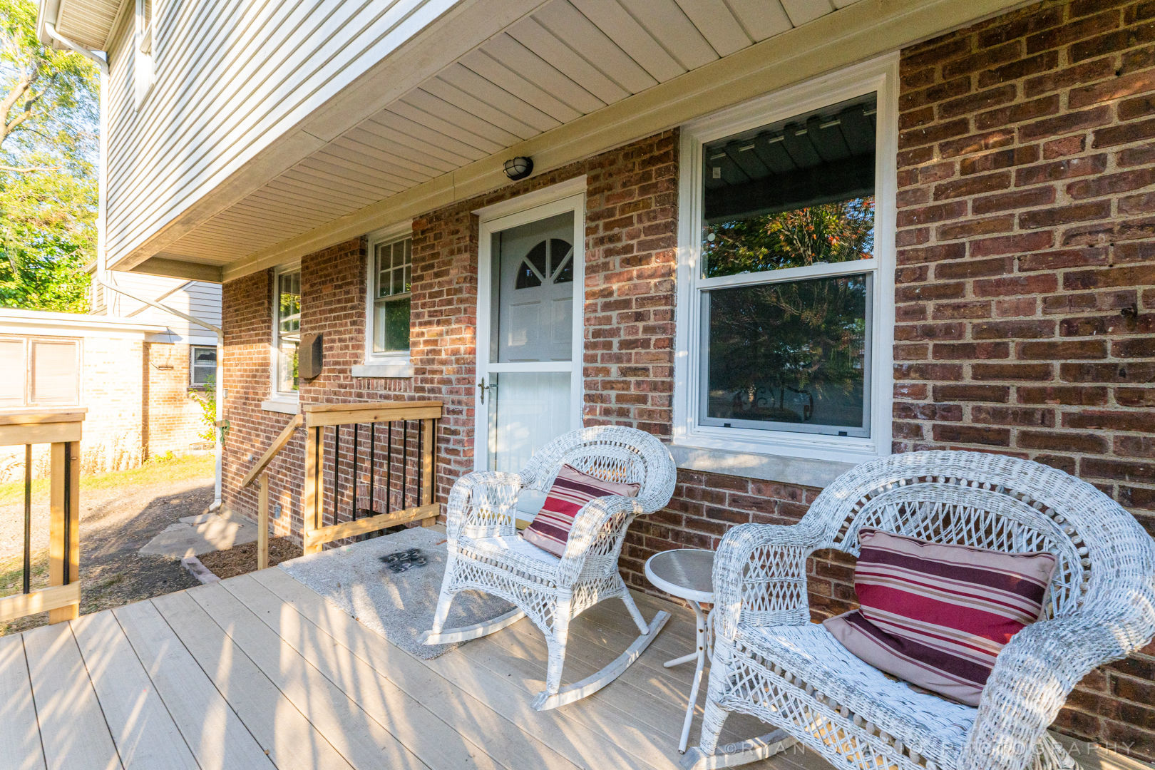 523 Kendall Lane DeKalb, IL 60115 - Photo 27 of 29 a view of a patio with table and chairs and wooden floor