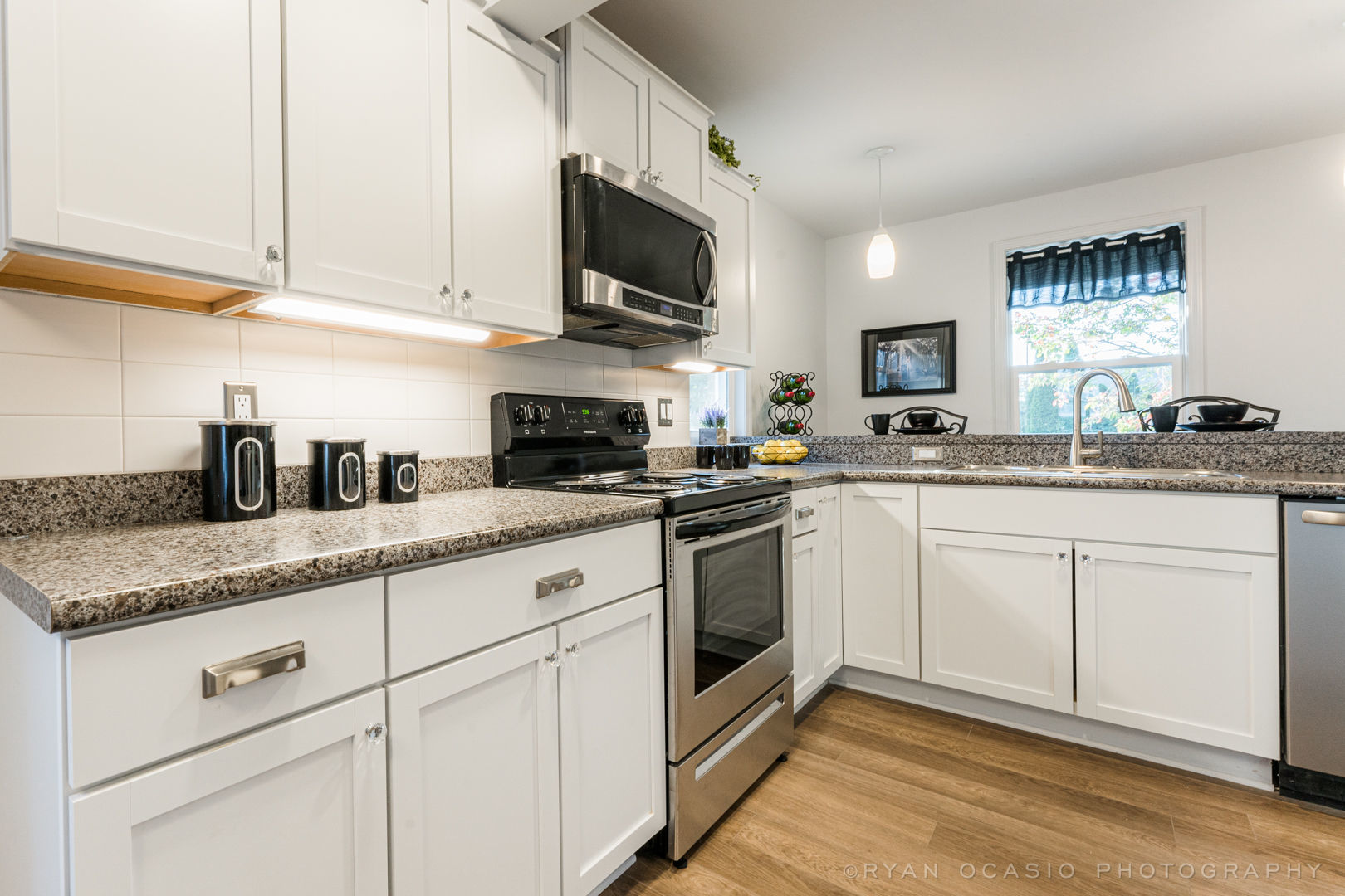 523 Kendall Lane DeKalb, IL 60115 - Photo 6 of 29 a kitchen with granite countertop white cabinets stainless steel appliances and a sink