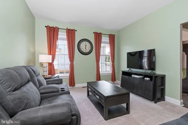 a kitchen with granite countertop stainless steel appliances and a refrigerator