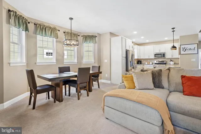 a view of a dining room with furniture and window