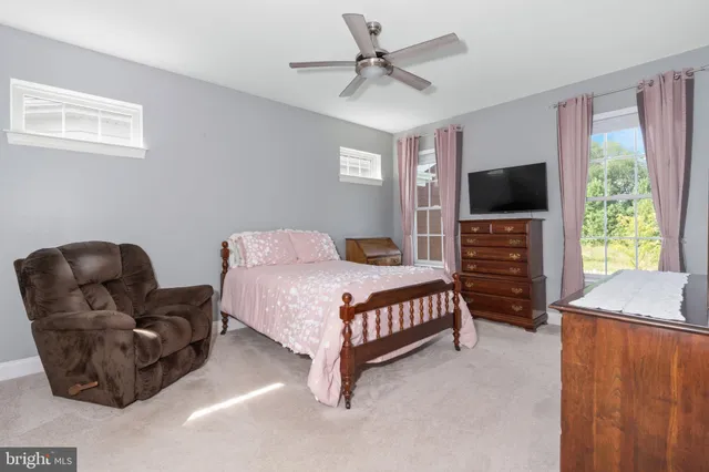 a bathroom with a double vanity sink a mirror and shower