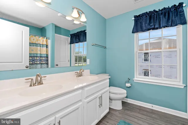 a room with a bed and a chair in it