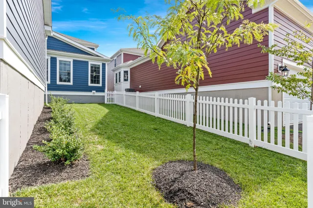 an aerial view of residential houses with outdoor space and swimming pool