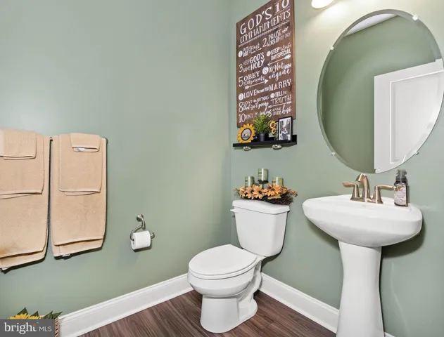 a living room with furniture a clock and a window