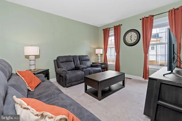 a kitchen with a refrigerator a sink and cabinets