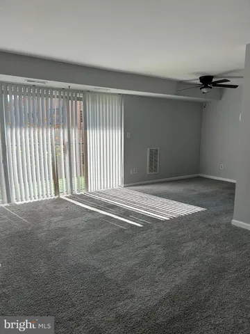 a view of empty room with windows