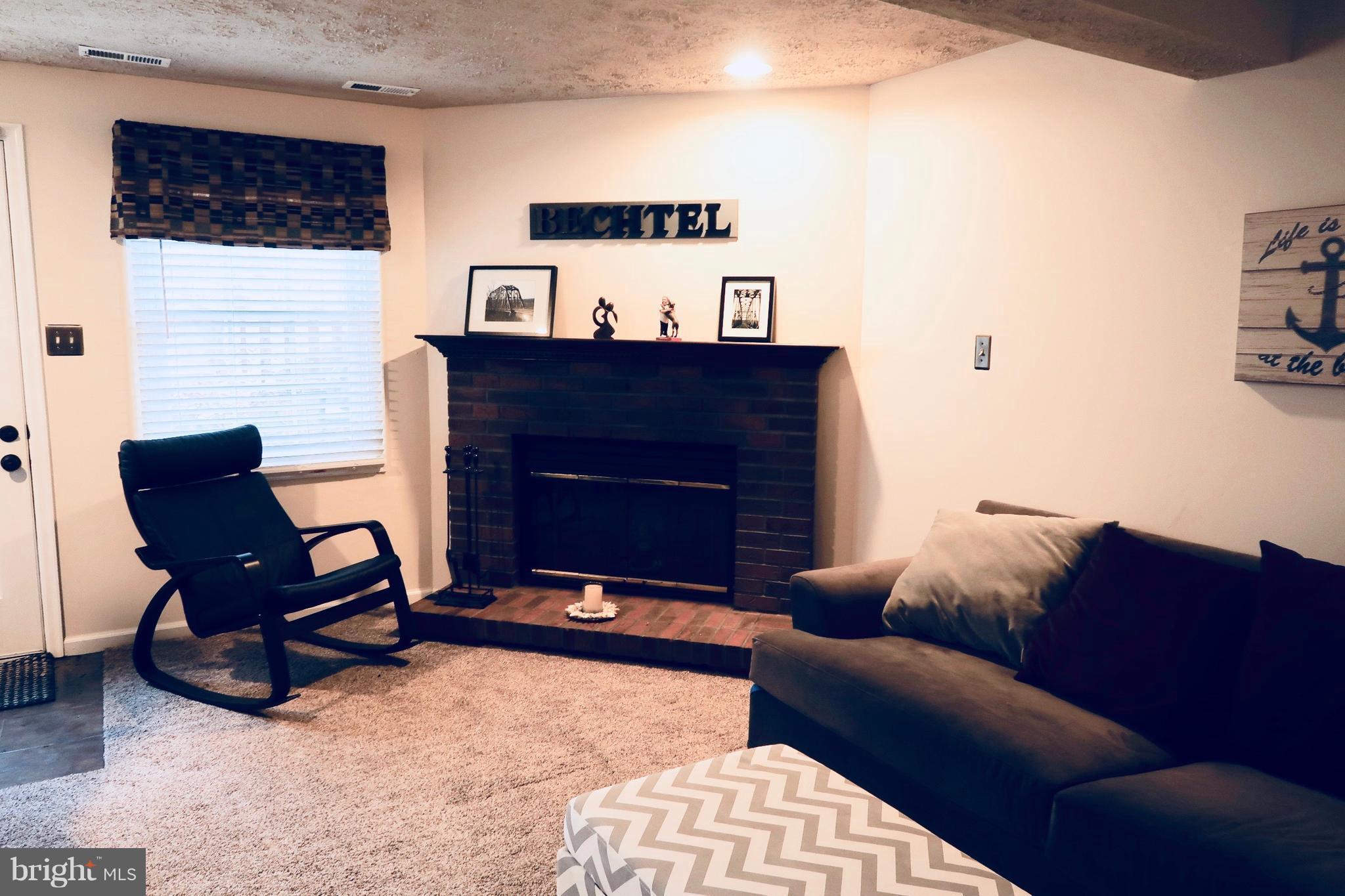 8512 Golden Ridge Court Lorton, VA 22079 - Photo 19 of 28 Lower Level Family room with Fireplace
