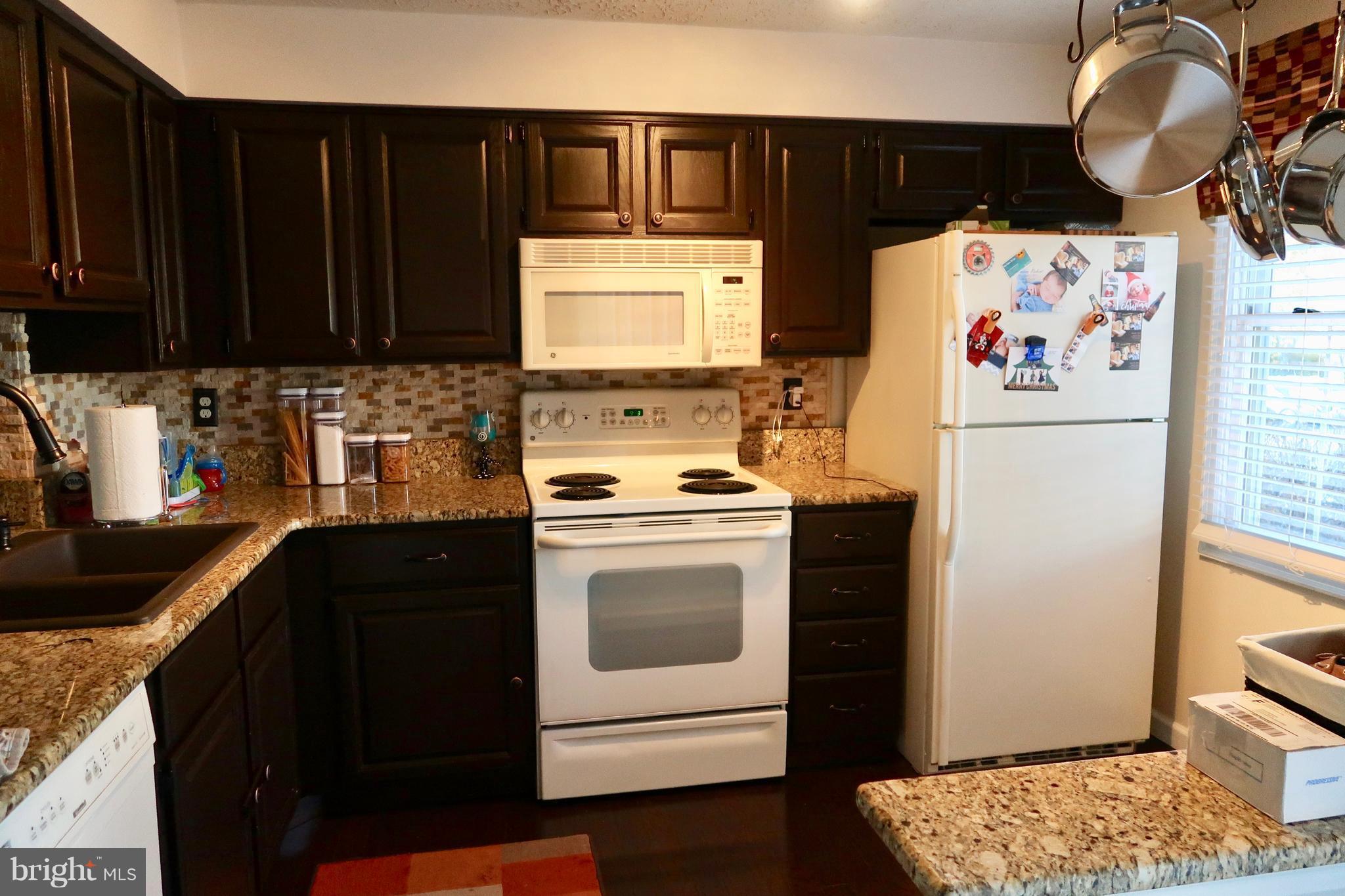8512 Golden Ridge Court Lorton, VA 22079 - Photo 4 of 28 Granit counters and composite granite sink.