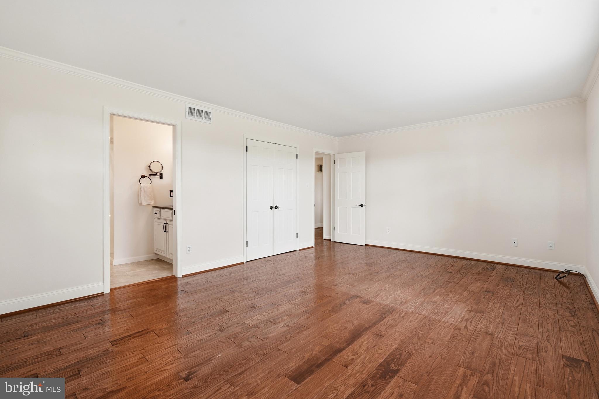 645 Mininger Road Souderton, PA 18964 - Photo 25 of 82 a view of an empty room with wooden floor and a window