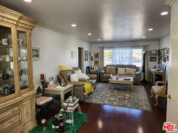 a living room with furniture and a rug