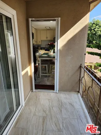 a view of a kitchen from the hallway