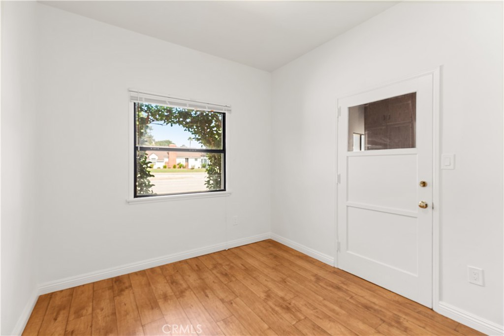 2701 Warren Way Arcadia, CA 91007 - Photo 14 of 30 an empty room with wooden floor and windows