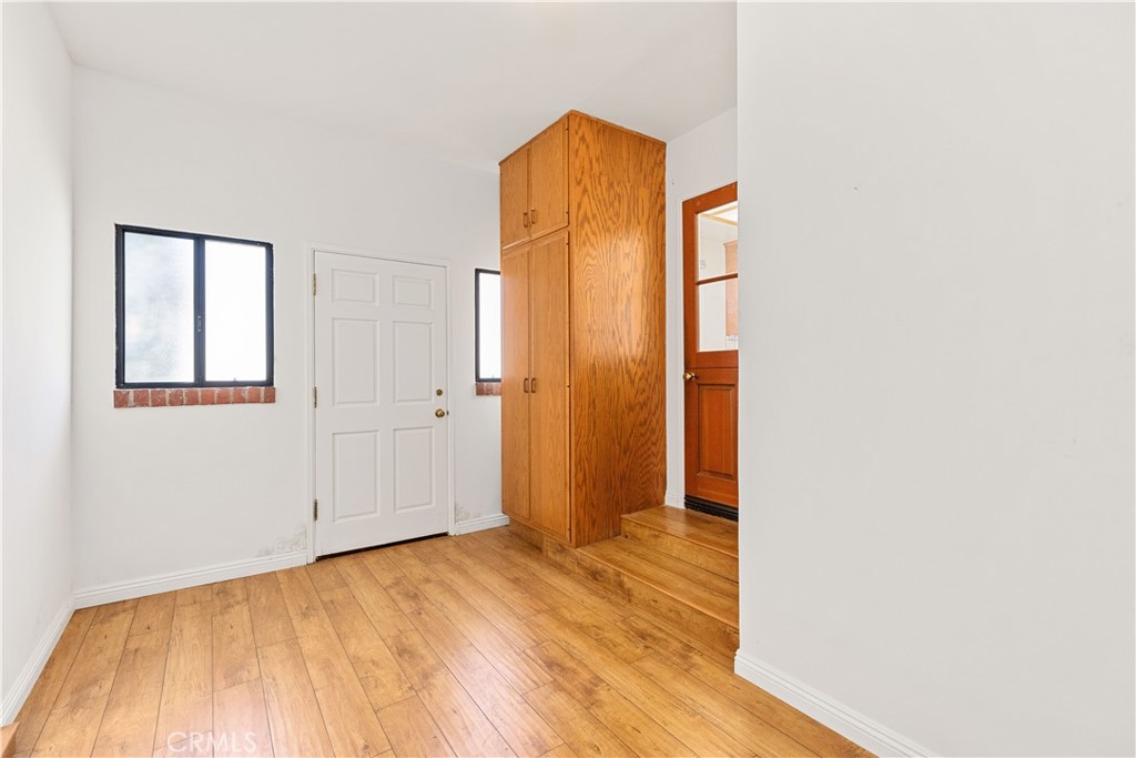 2701 Warren Way Arcadia, CA 91007 - Photo 20 of 30 a view of an empty room with wooden floor and a bathroom