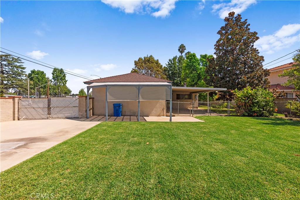 2701 Warren Way Arcadia, CA 91007 - Photo 25 of 30 a front view of a house with a garden and trees