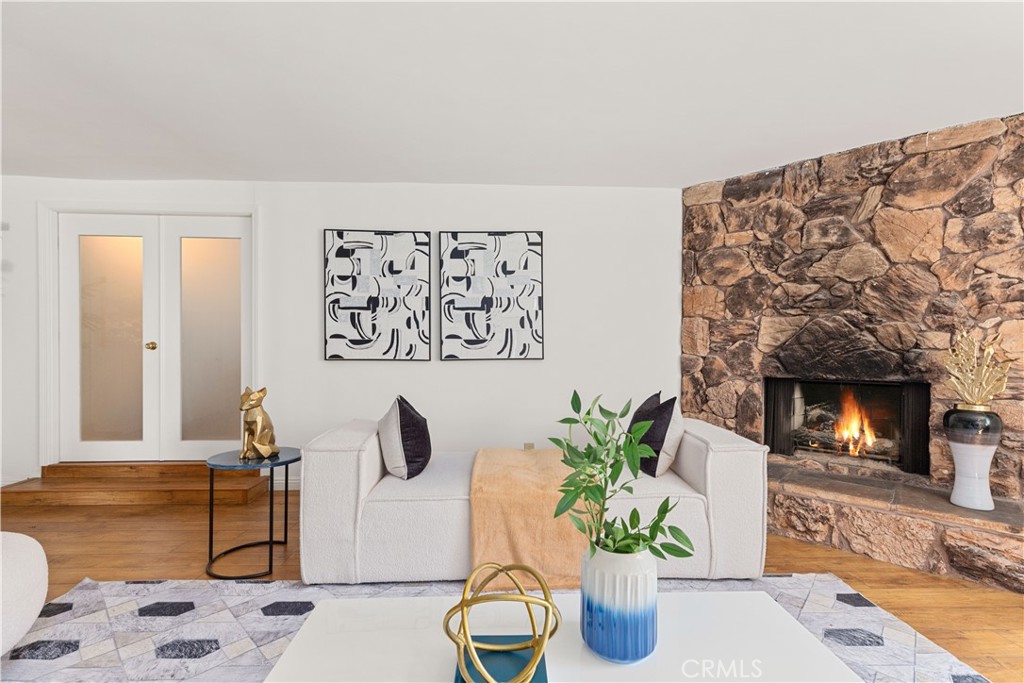 2701 Warren Way Arcadia, CA 91007 - Photo 7 of 30 a living room with furniture a fireplace and wooden floor