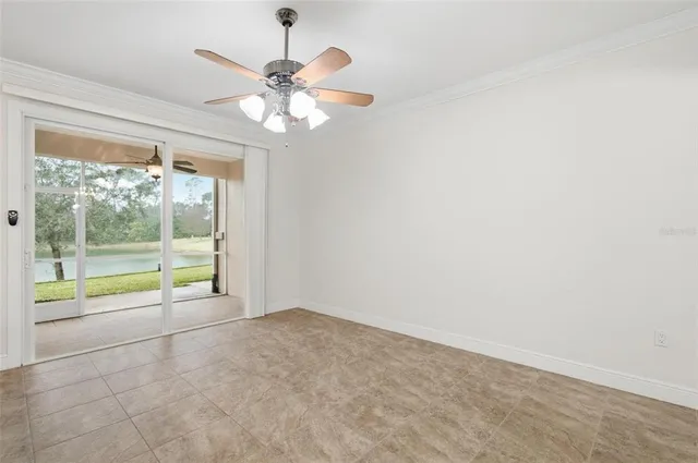 a large kitchen with granite countertop a stove a sink a window and refrigerator