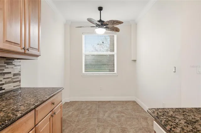 an aerial view of a house with a lake view