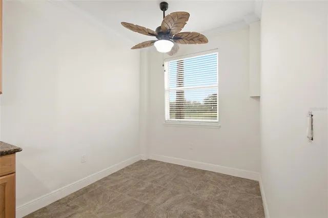 a view of a hallway with bathroom and wooden floor