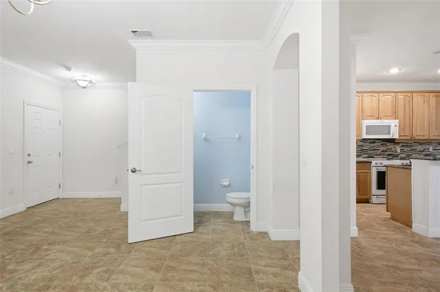 a view of a small space with wooden floor