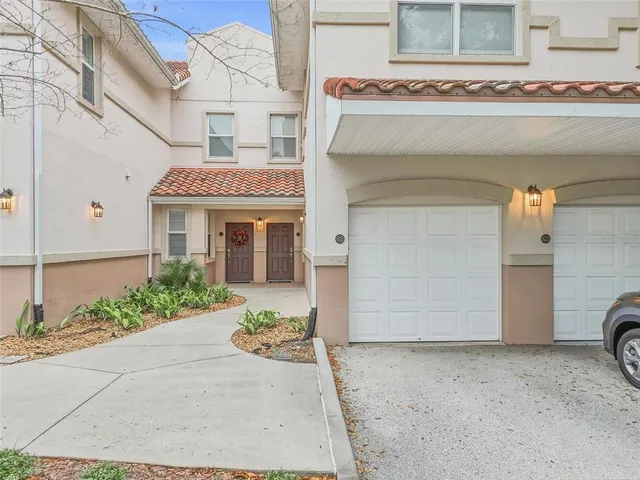 a front view of a house with a garage