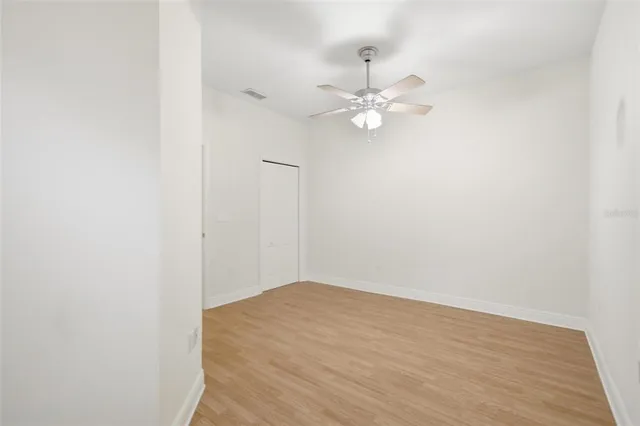 an empty room with wooden floor