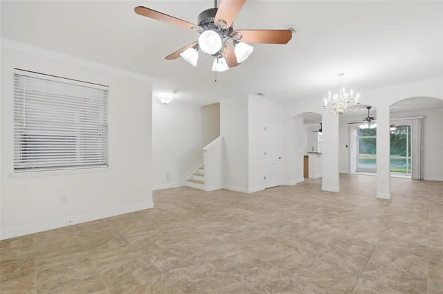en view interior of a house with a chandelier fan