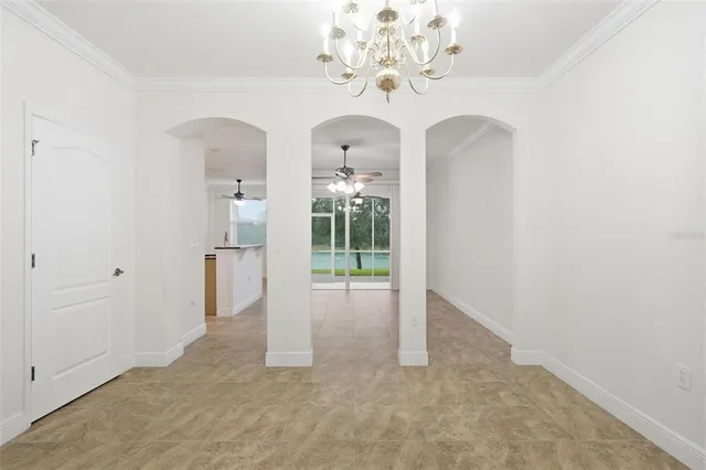 a view of counter top kitchen appliances and cabinets