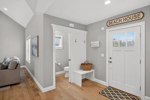 a living room with a couch and wooden floor