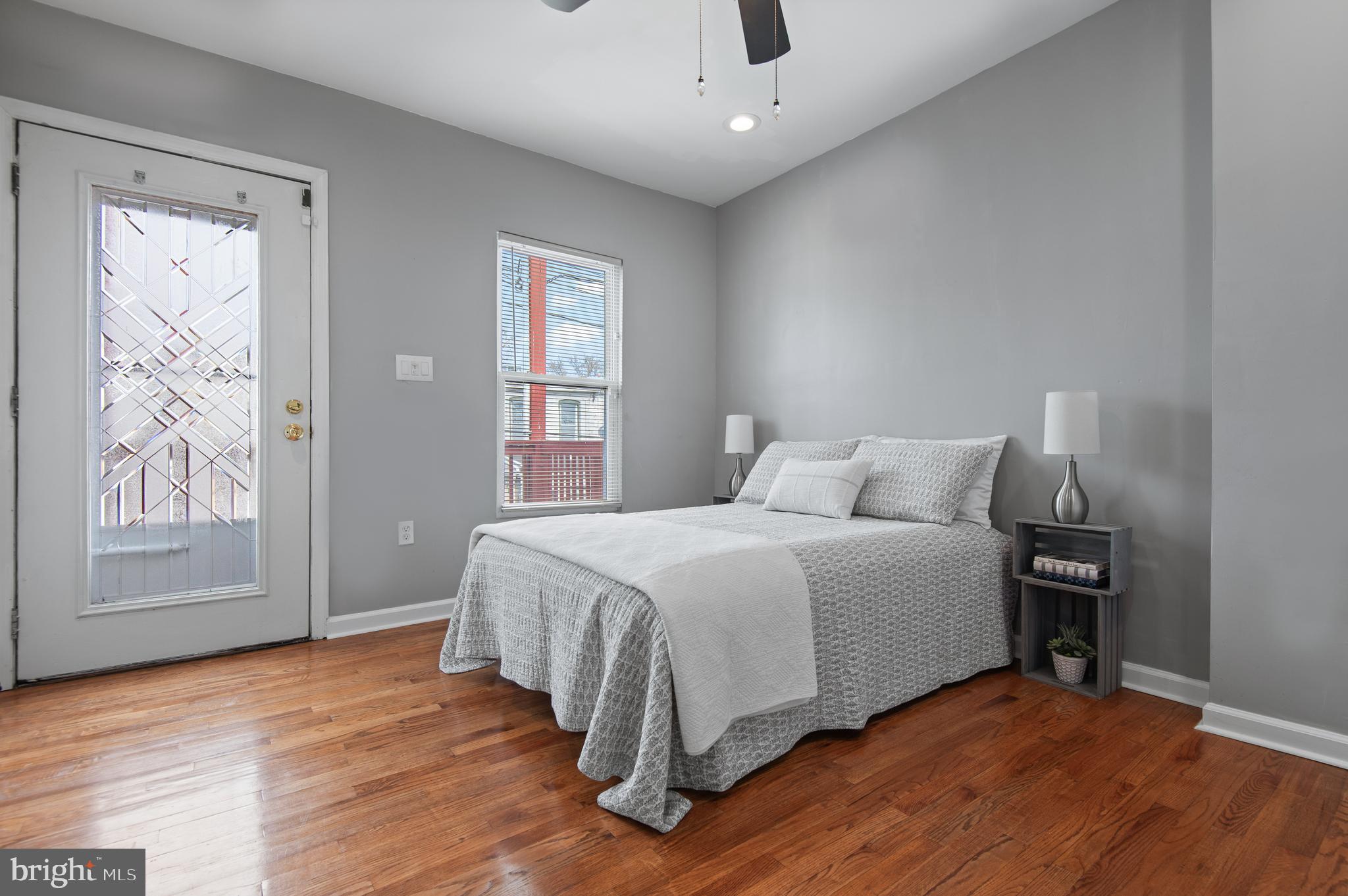 1236 Sargeant Street Baltimore, MD 21223 - Photo 11 of 19 a spacious bedroom with a bed and a window
