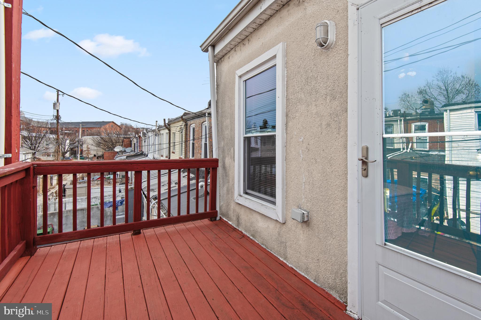 1236 Sargeant Street Baltimore, MD 21223 - Photo 13 of 19 a view of a balcony with wooden floor