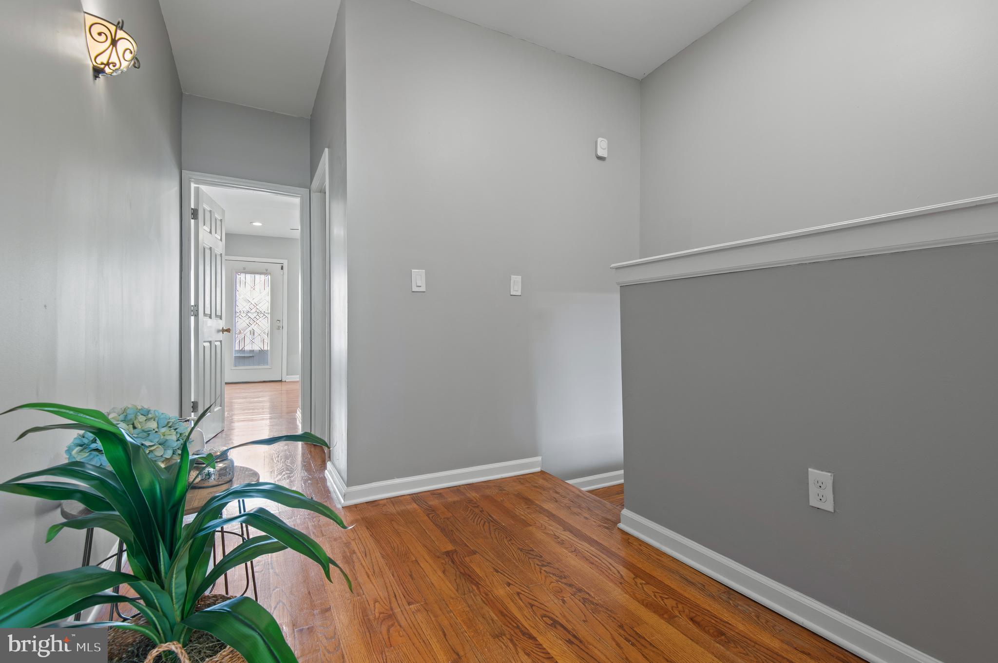 1236 Sargeant Street Baltimore, MD 21223 - Photo 15 of 19 a view of a hallway with wooden floor