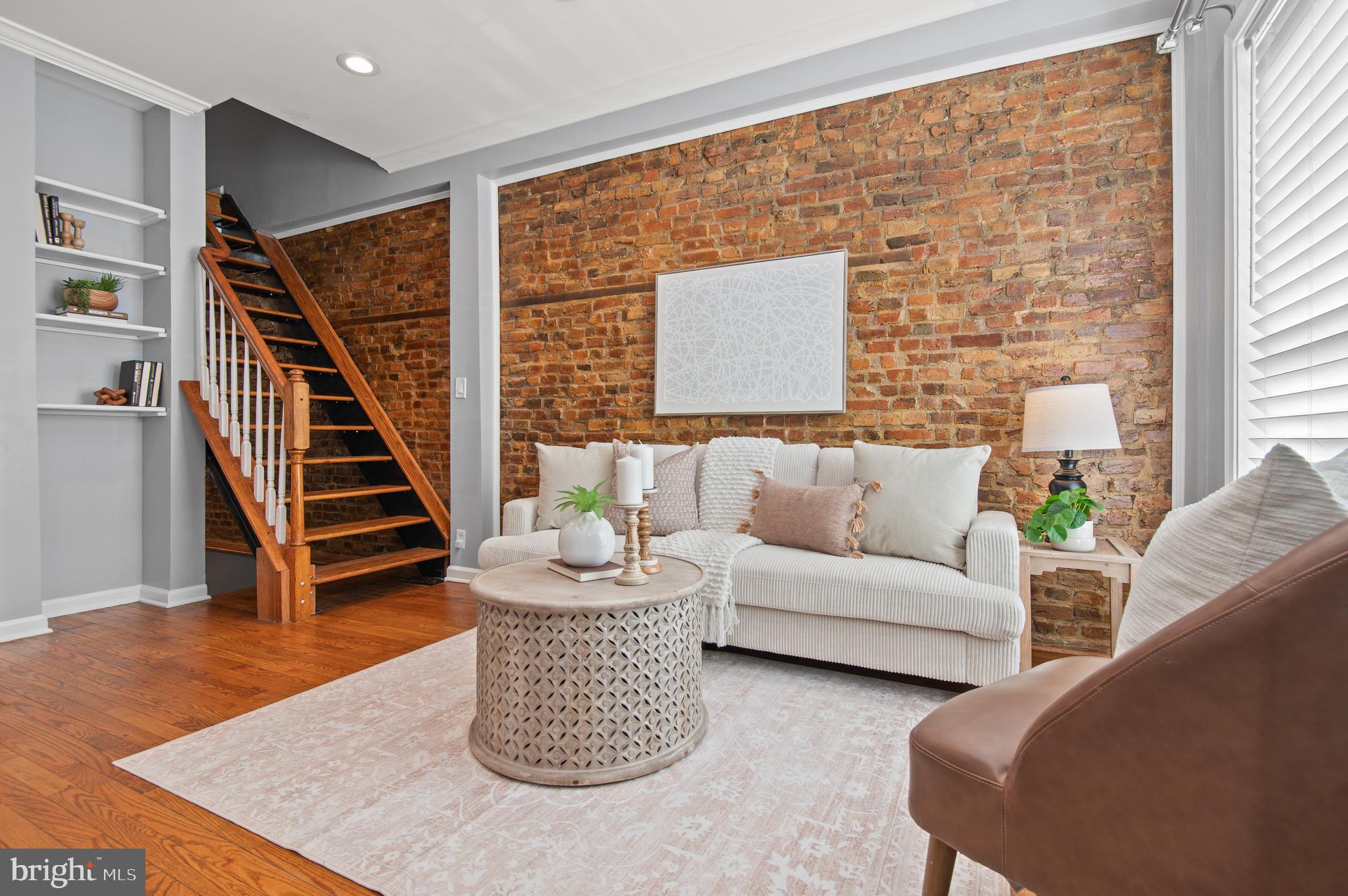 1236 Sargeant Street Baltimore, MD 21223 - Photo 2 of 19 a living room with furniture and wooden floor