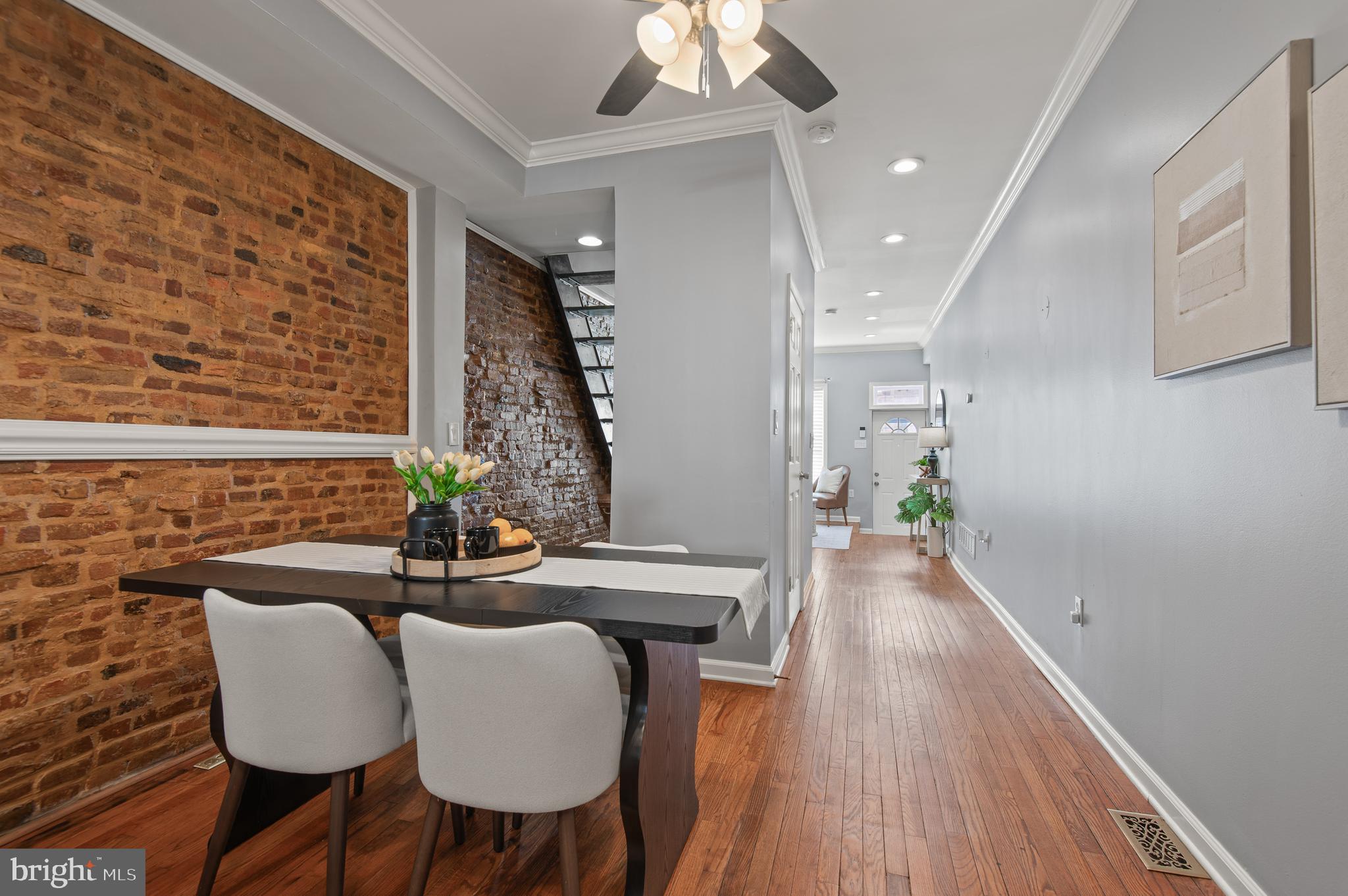 1236 Sargeant Street Baltimore, MD 21223 - Photo 5 of 19 a dining room with furniture and wooden floor