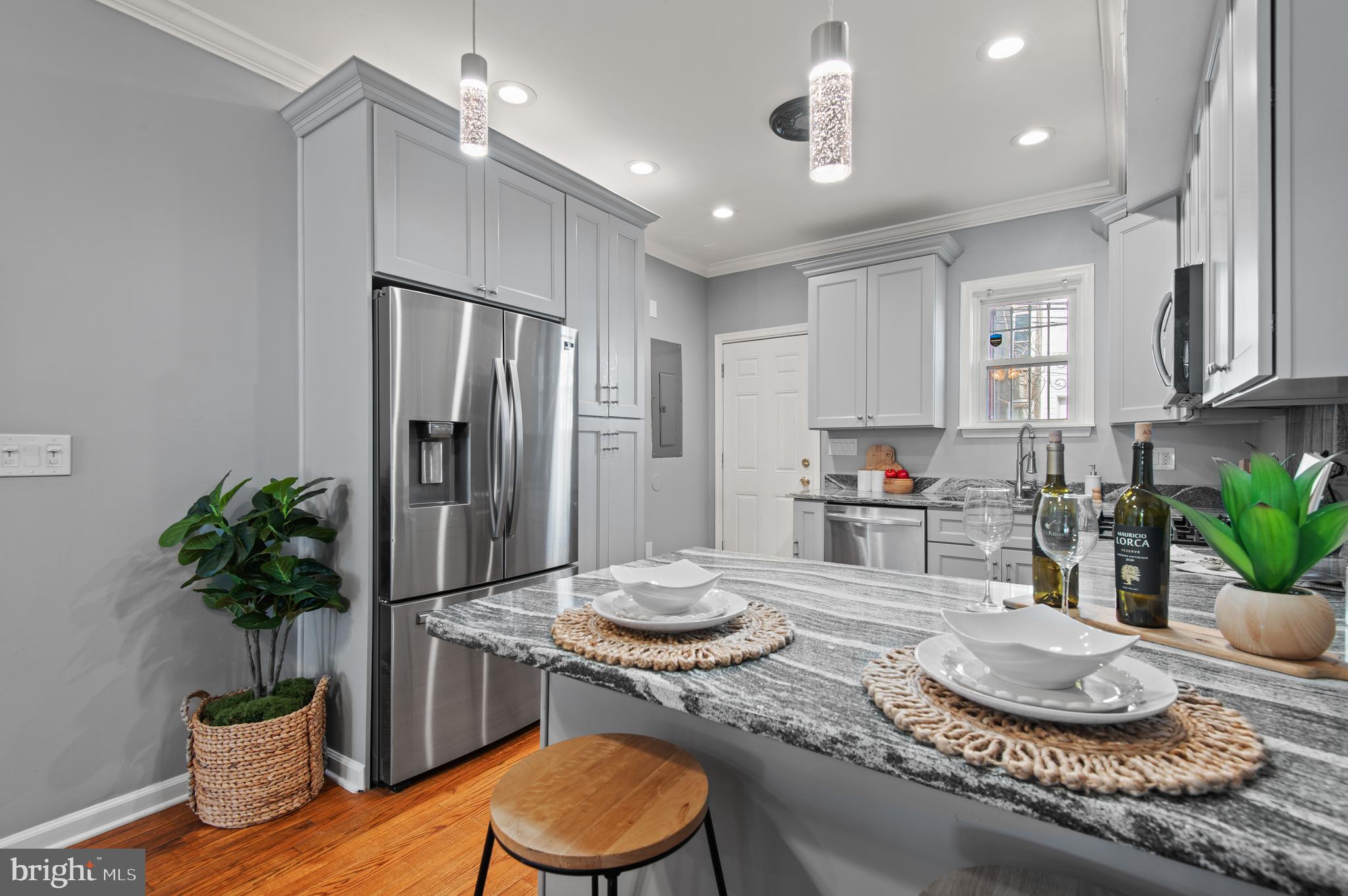 1236 Sargeant Street Baltimore, MD 21223 - Photo 6 of 19 a kitchen with granite countertop a sink and a stove