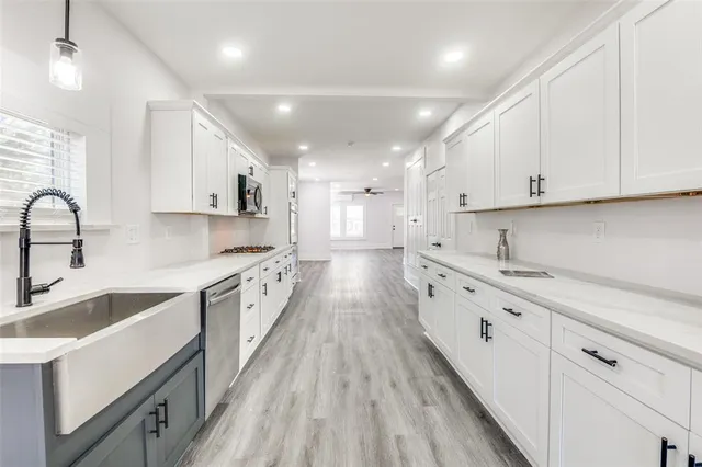 a large kitchen with cabinets