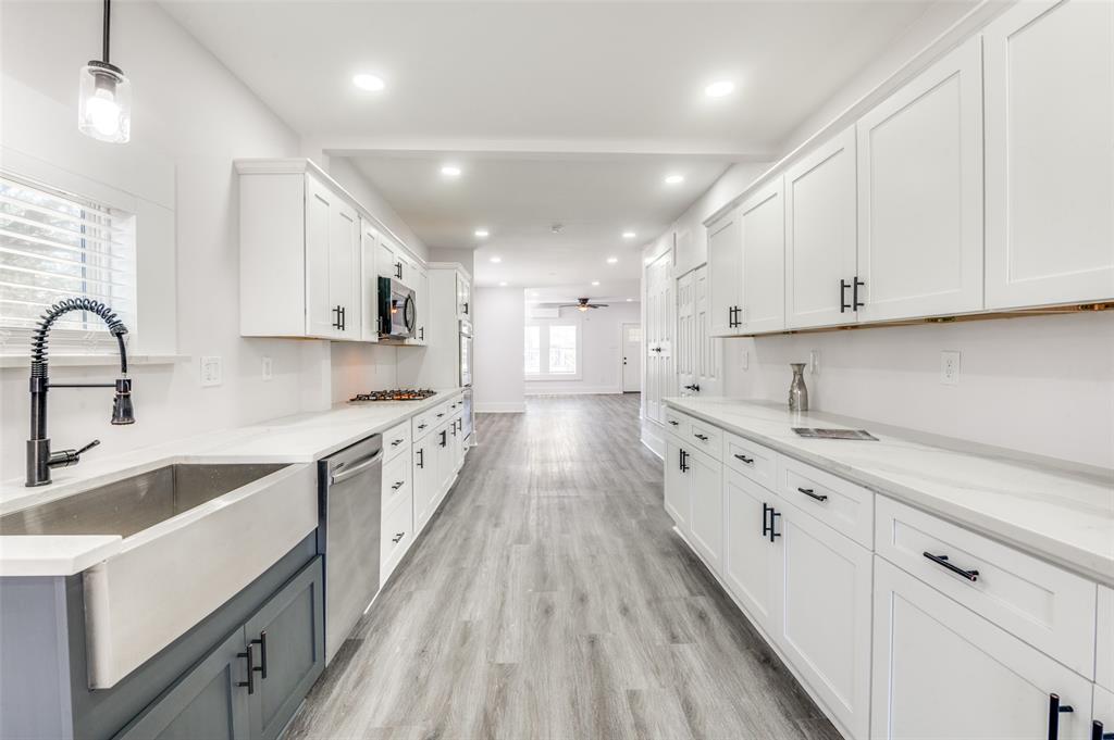 a large kitchen with cabinets