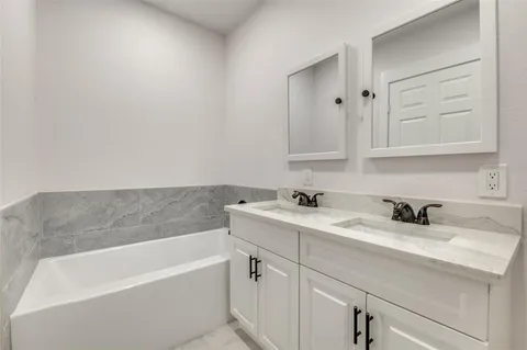 a bathroom with a sink and a bathtub