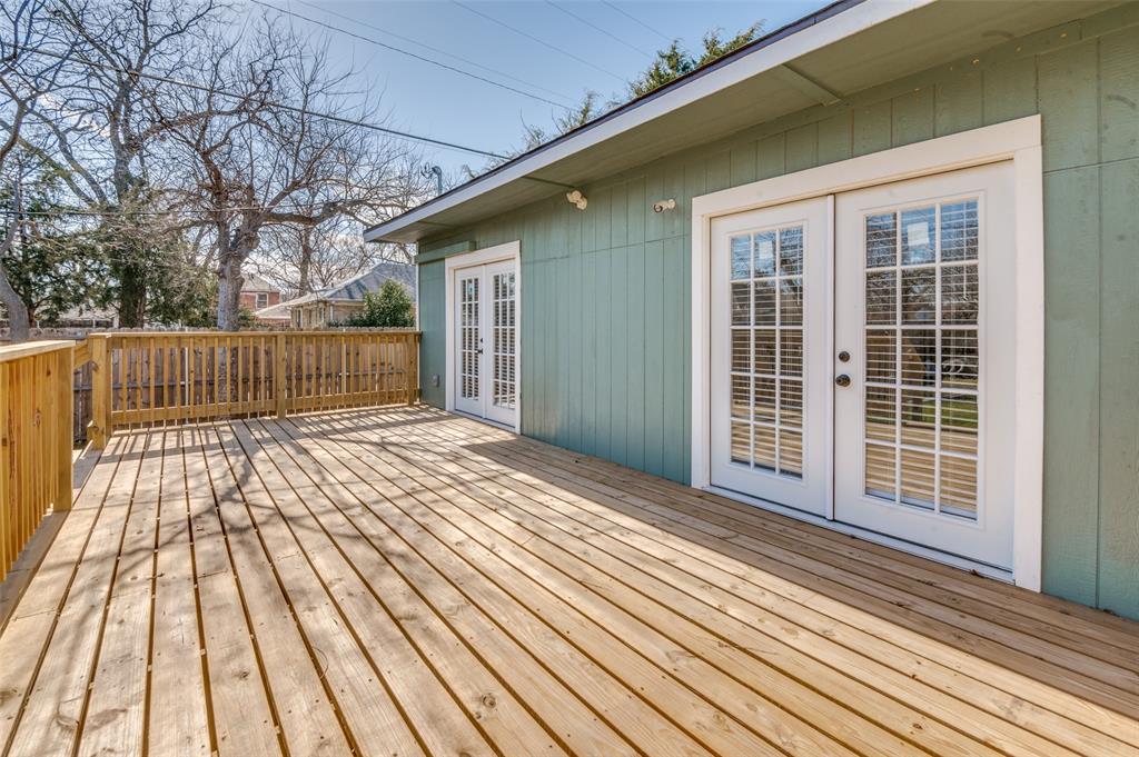 2502 West Lovers Lane Dallas, TX 75235 - Photo 17 of 20 a view of backyard with wooden deck