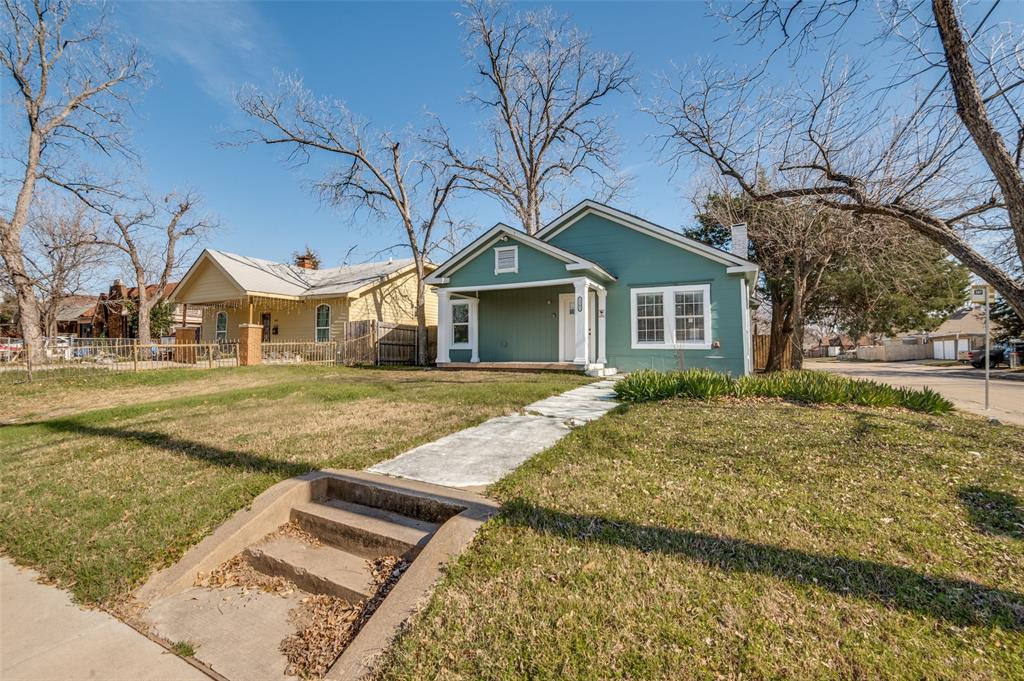 2502 West Lovers Lane Dallas, TX 75235 - Photo 19 of 20 a front view of a house with a yard