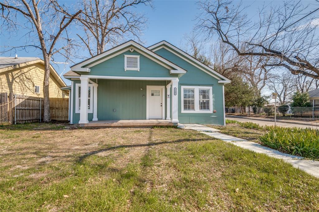 2502 West Lovers Lane Dallas, TX 75235 - Photo 20 of 20 a front view of a house with a yard and garage