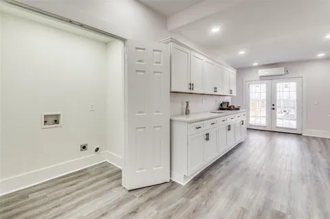 a view of a kitchen with electric appliances