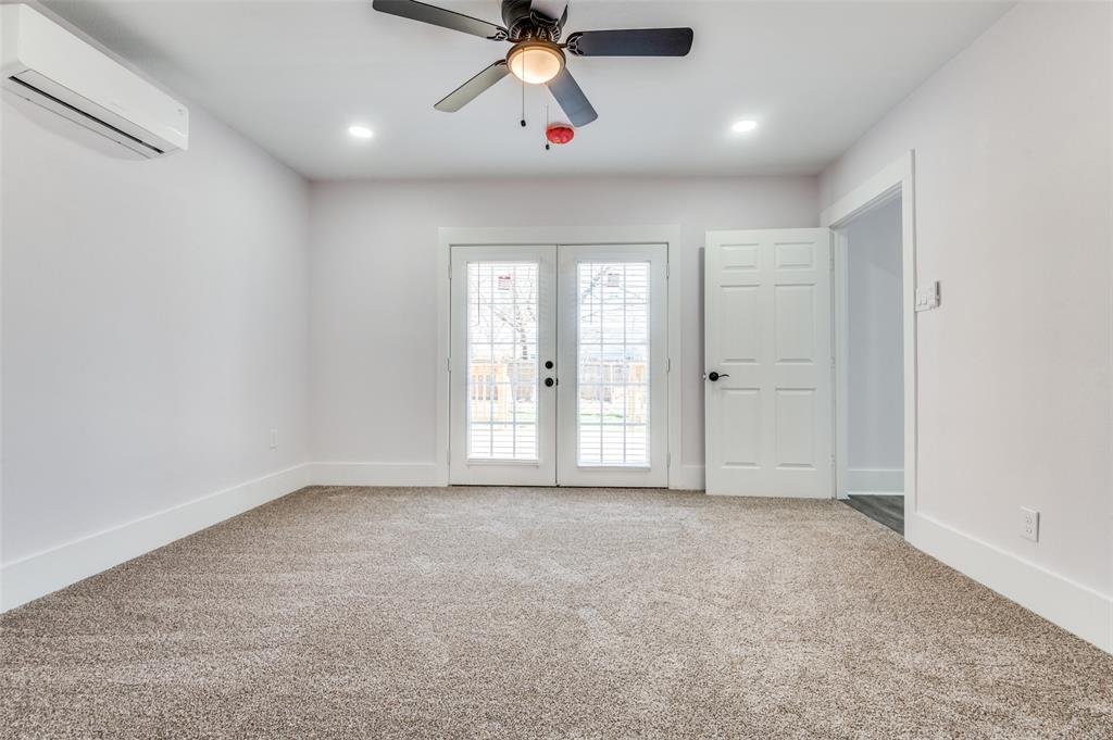 2502 West Lovers Lane Dallas, TX 75235 - Photo 9 of 20 an empty room with windows and fan