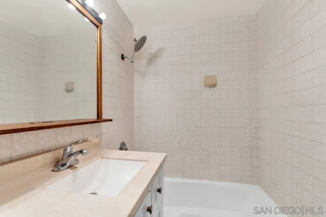 a bathroom with a sink and a bathtub