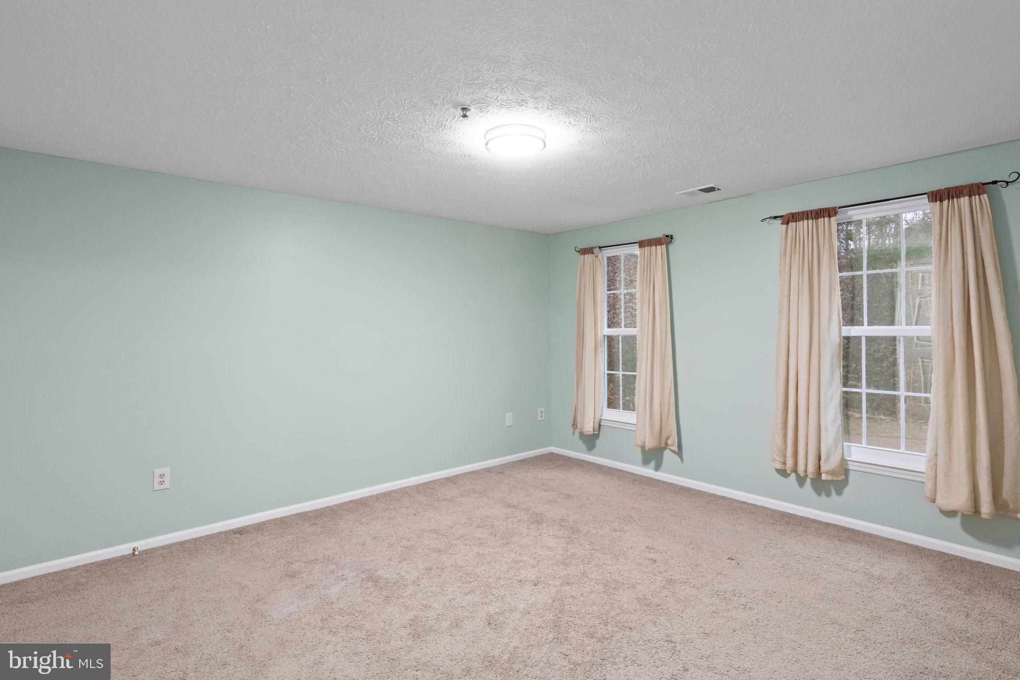 1404 Golden Rod Court, Unit B Belcamp, MD 21017 - Photo 18 of 25 an empty room with windows