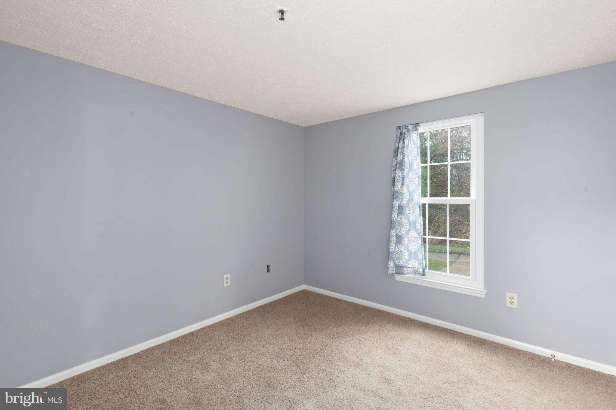 1404 Golden Rod Court, Unit B Belcamp, MD 21017 - Photo 22 of 25 an empty room with a window