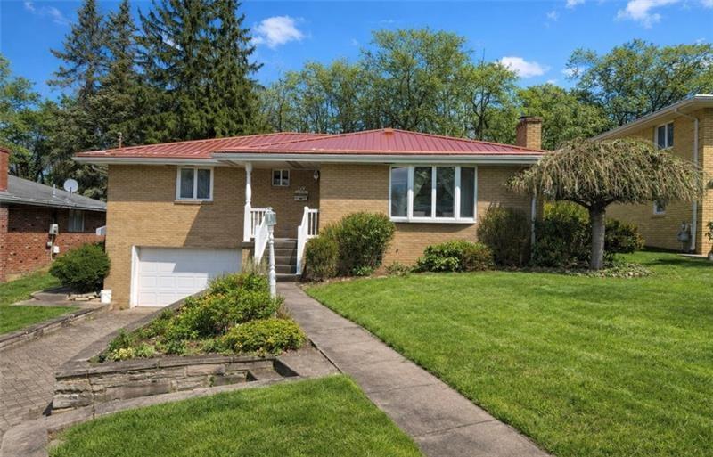 719 Locust Street Greensburg, PA 15601 - Photo 1 of 18 a front view of a house with a yard