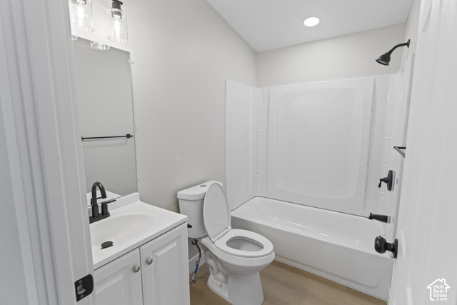 96 Barrington Way Layton, UT 84041 - Photo 10 of 18 White vanity with a single basin sink, matte black faucet, and a two-light vanity fixture