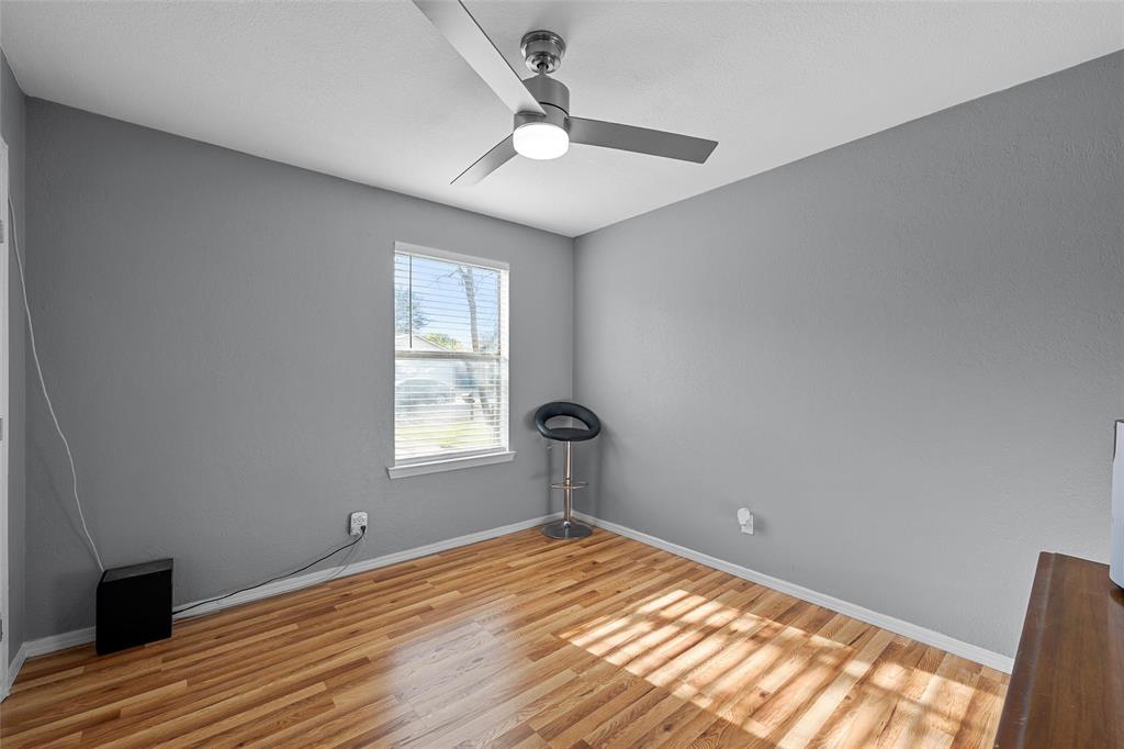 711 Rosedale Drive Hewitt, TX 76643 - Photo 14 of 16 a view of empty room with wooden floor and fan