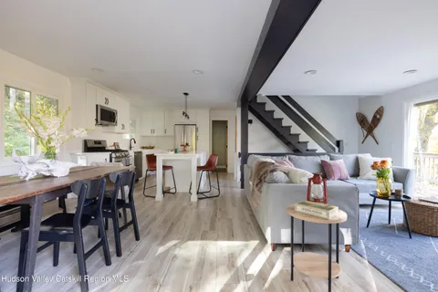 a living room with furniture fireplace and flat screen tv